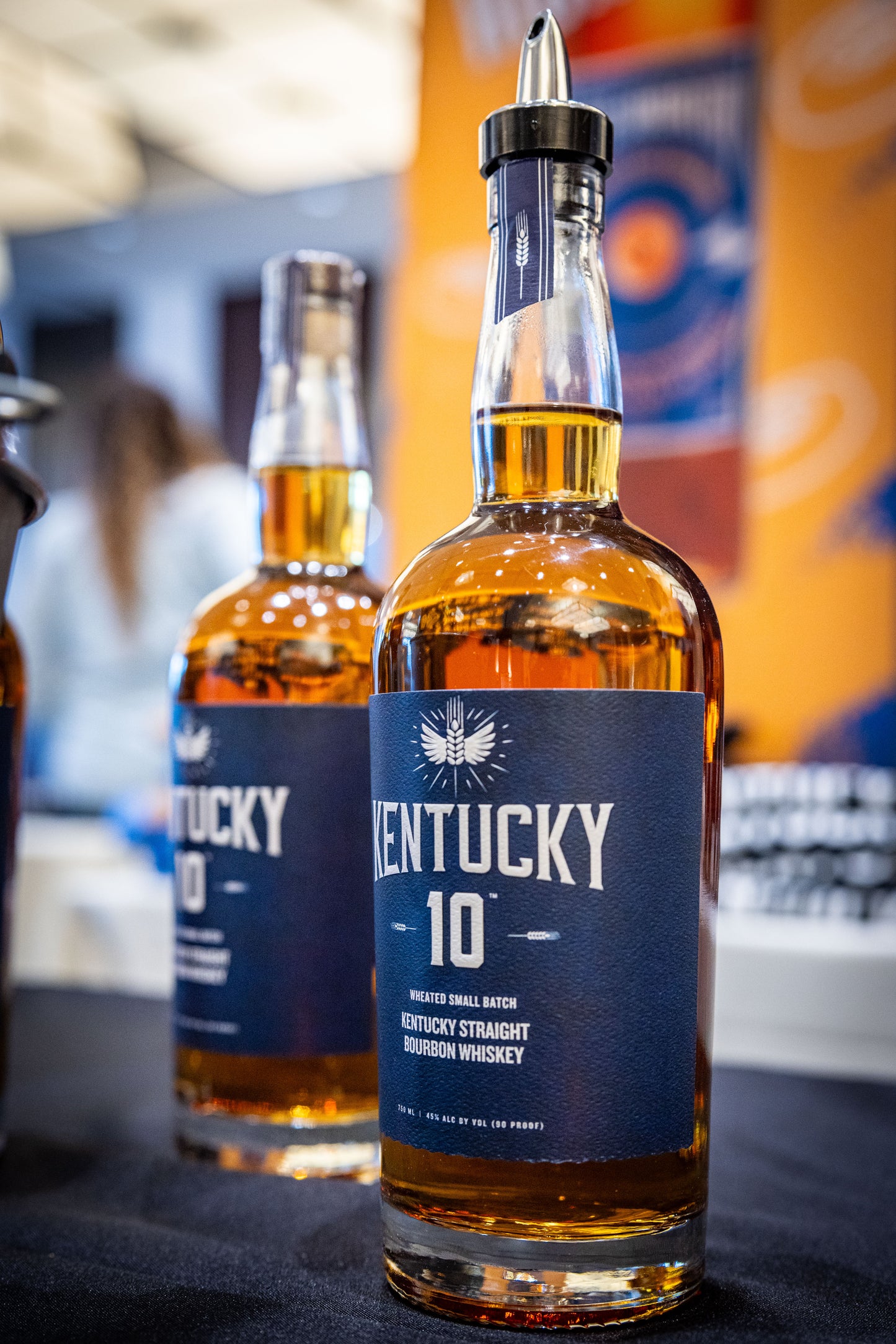 Bottle of Kentucky 10 at a conference ready to be poured.