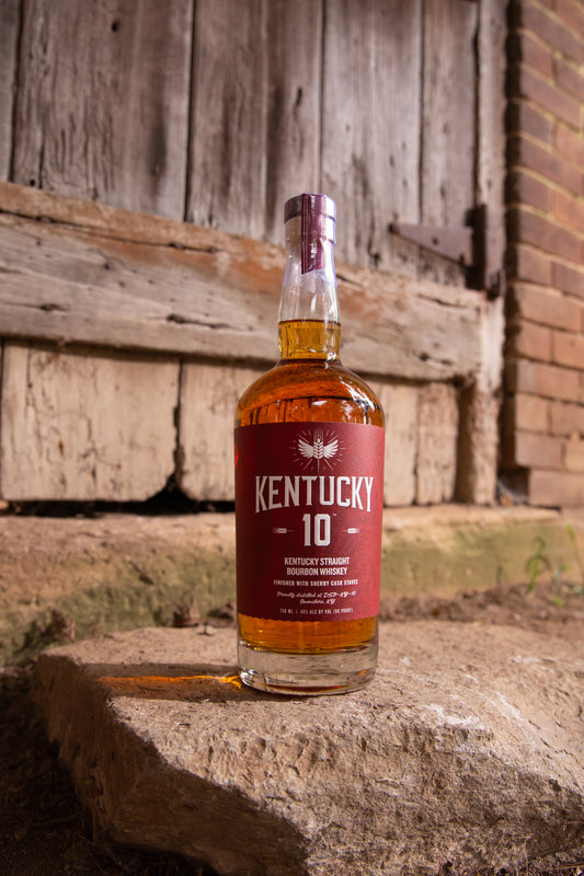 Red bottle of Kentucky 10 Bourbon outside