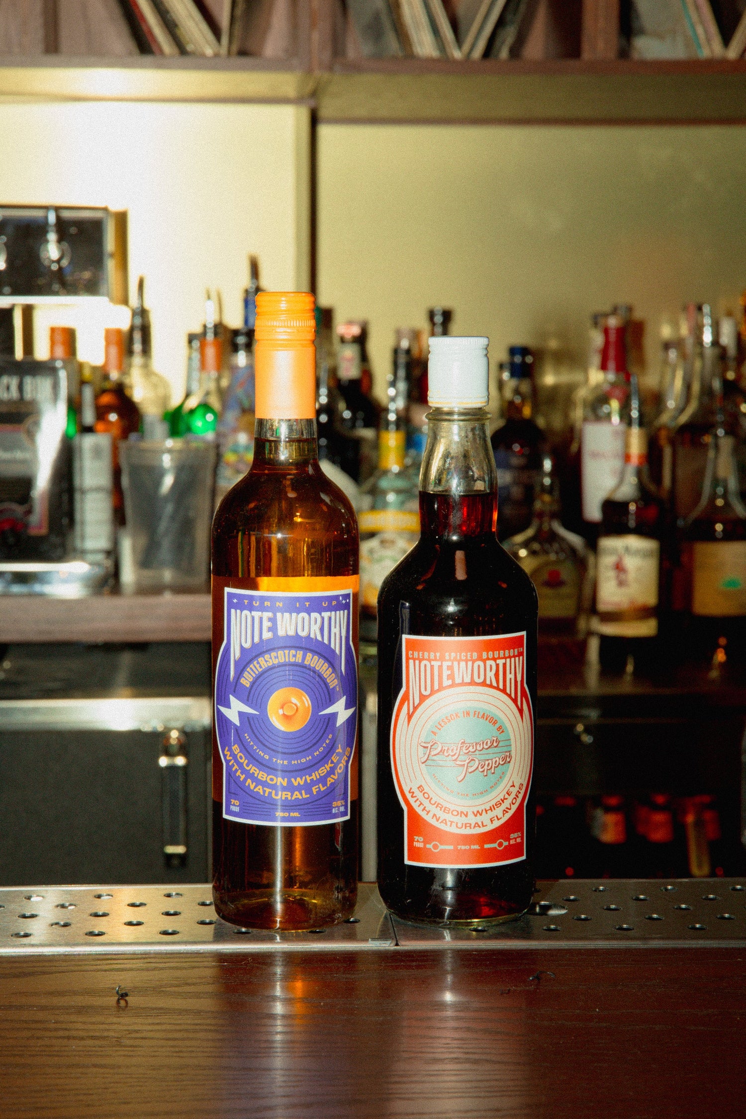 A bottle of Noteworthy Butterscotch Bourbon with butterscotch splashed all over.
