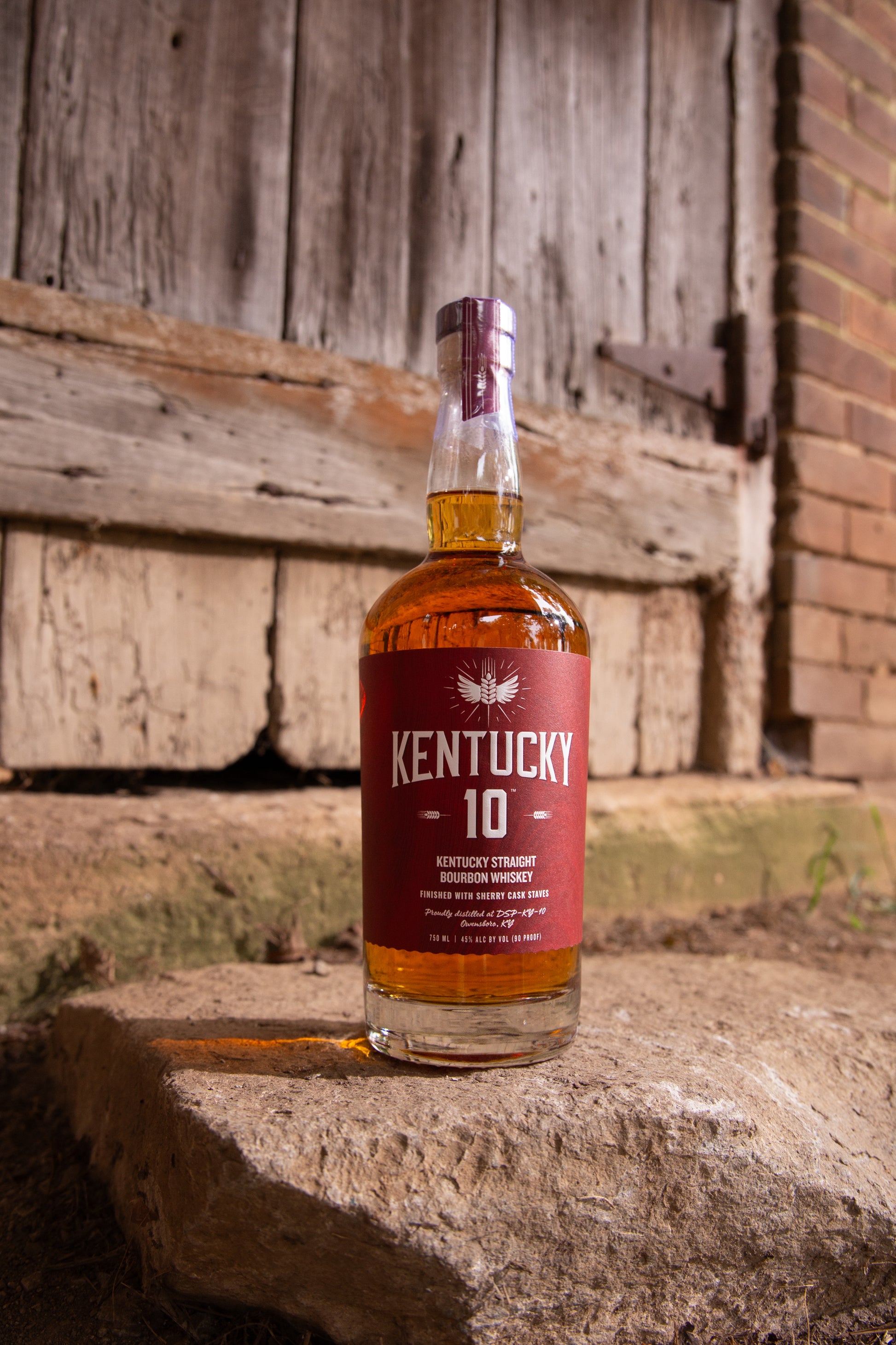 Red bottle of Kentucky 10 Bourbon outside